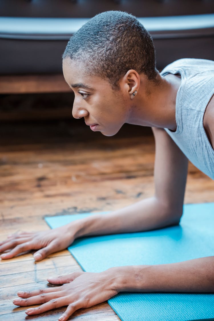 Strong Black Woman Doing Forearm Plank