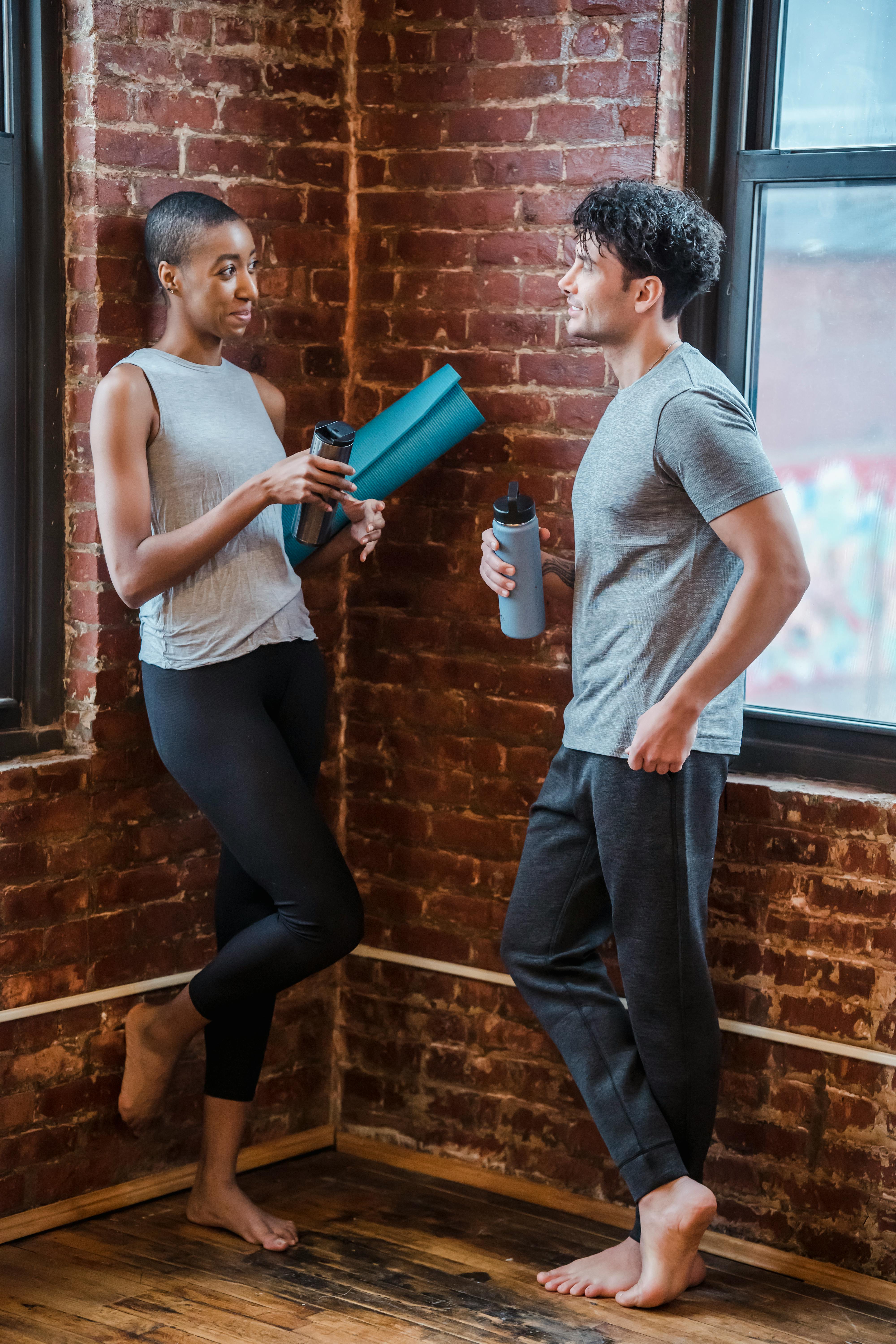 sporty multiracial couple having conversation