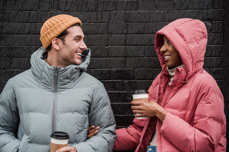 Happy Multiethnic Couple With Coffee In City