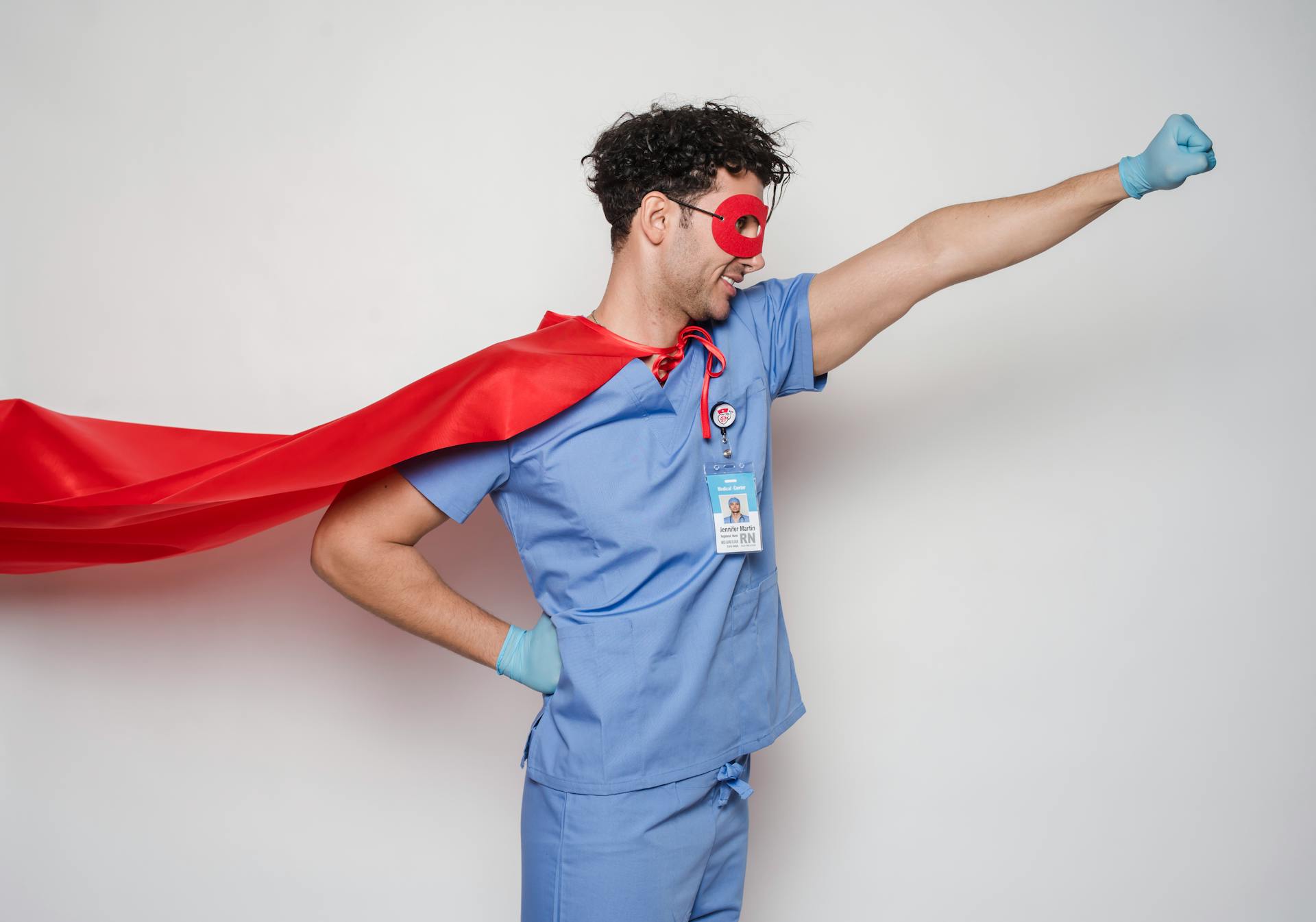 Positive doctor in red superhero costume