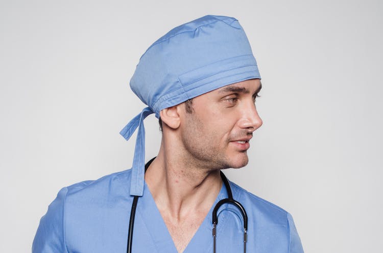 Doctor In Uniform With Stethoscope In Clinic