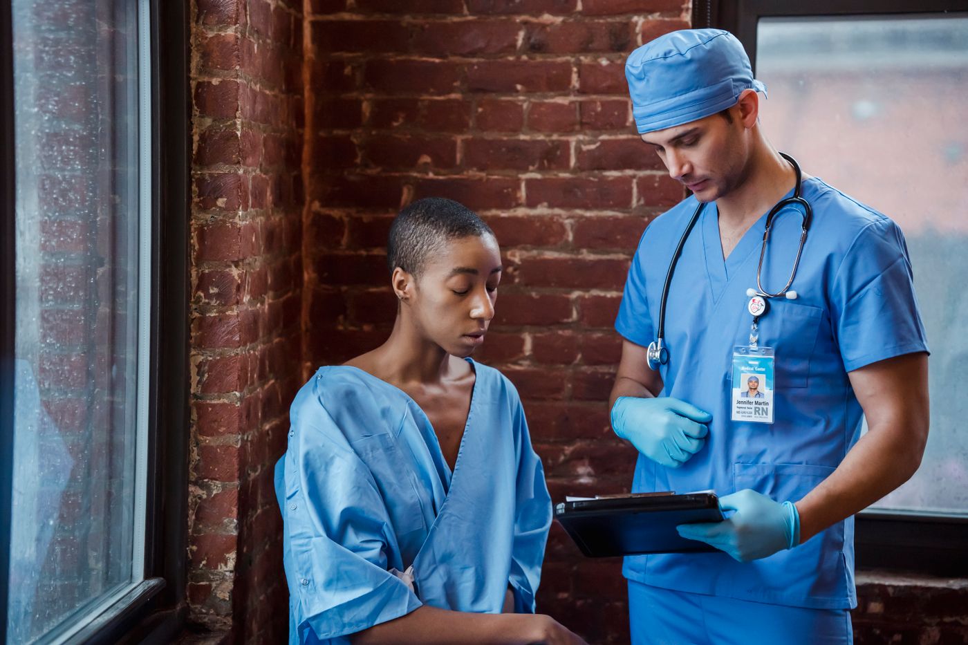 Healthcare professional supporting a Black patient