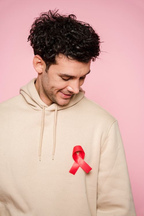 Man With Ribbon Man With Red Ribbon On Clothing · Free Stock Photo