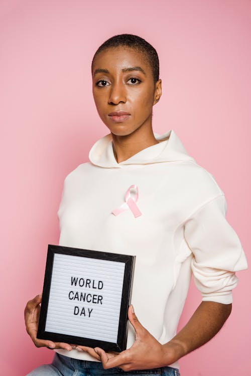 Woman Holding A Frame With Words On It