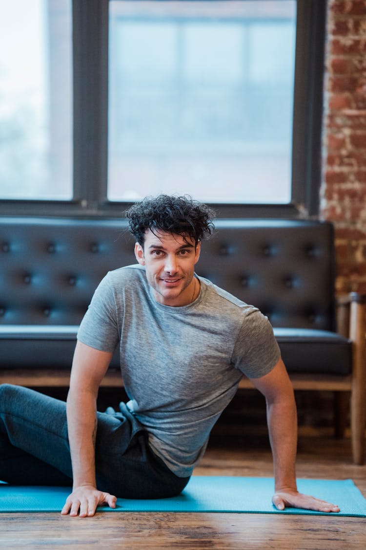 Smiling Man Doing Exercise For Abs