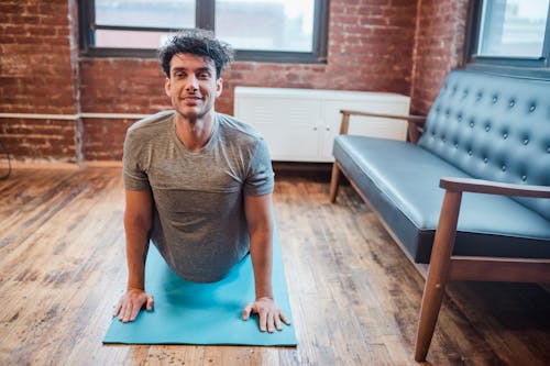 Positive man strengthening spine in High Cobra position