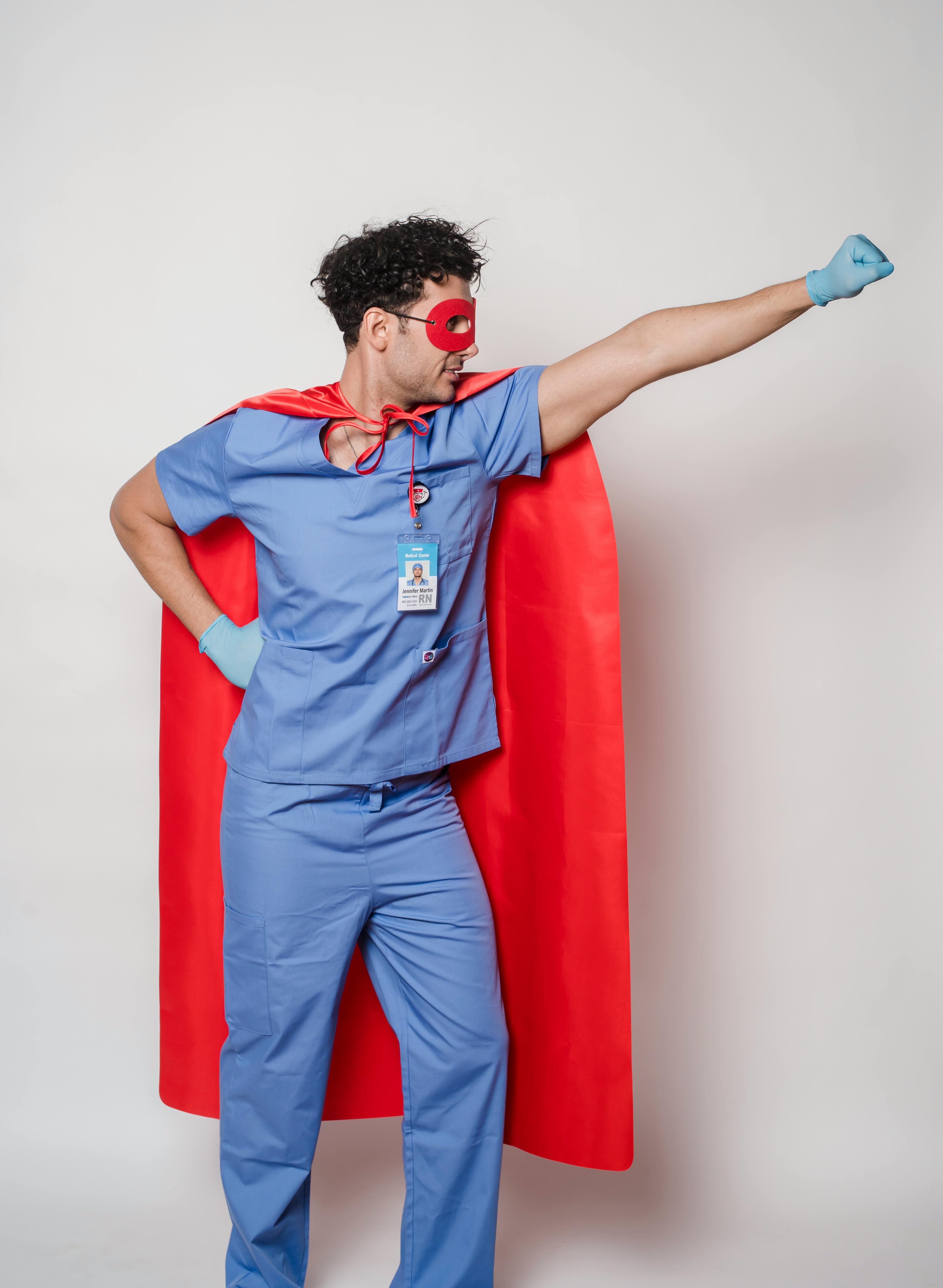 male doctor in superhero raising fist for protection against covid