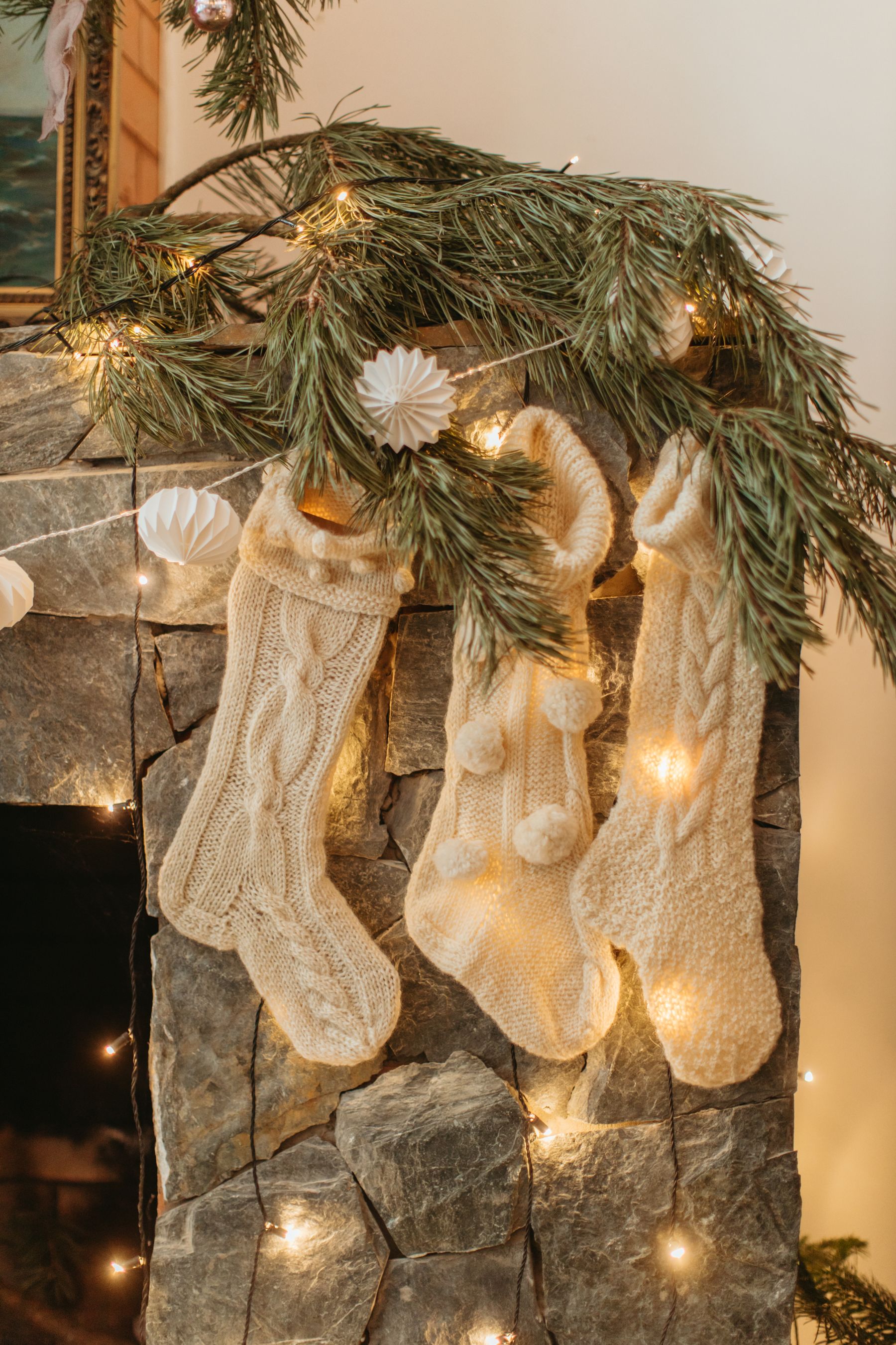 Christmas mantel with a central mirror and varied decorative heights