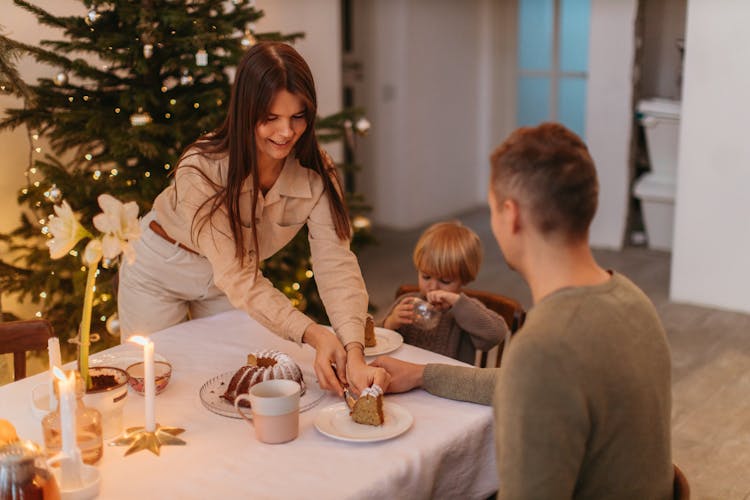 A Family Eating Dessert At The Table