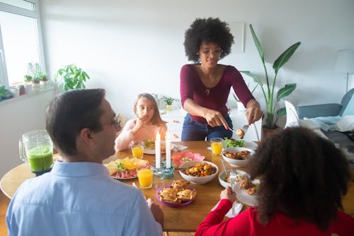 Free A Family Eating Together at Home Stock Photo