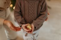 Woman in Brown Sweater Wearing Gold Ring