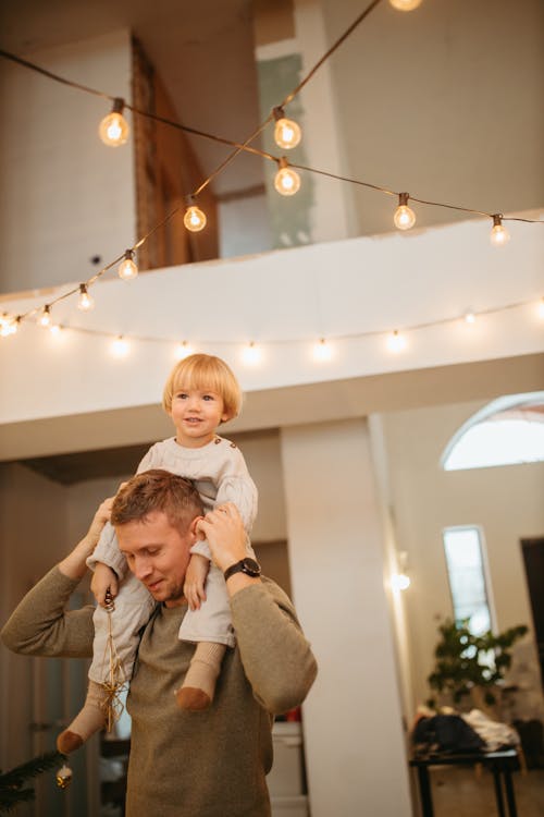 Man Carrying a Boy on His Shoulders