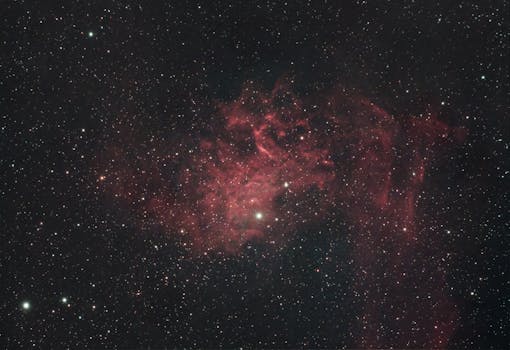 A breathtaking capture of the Flaming Star Nebula with stars in a vast cosmic background.
