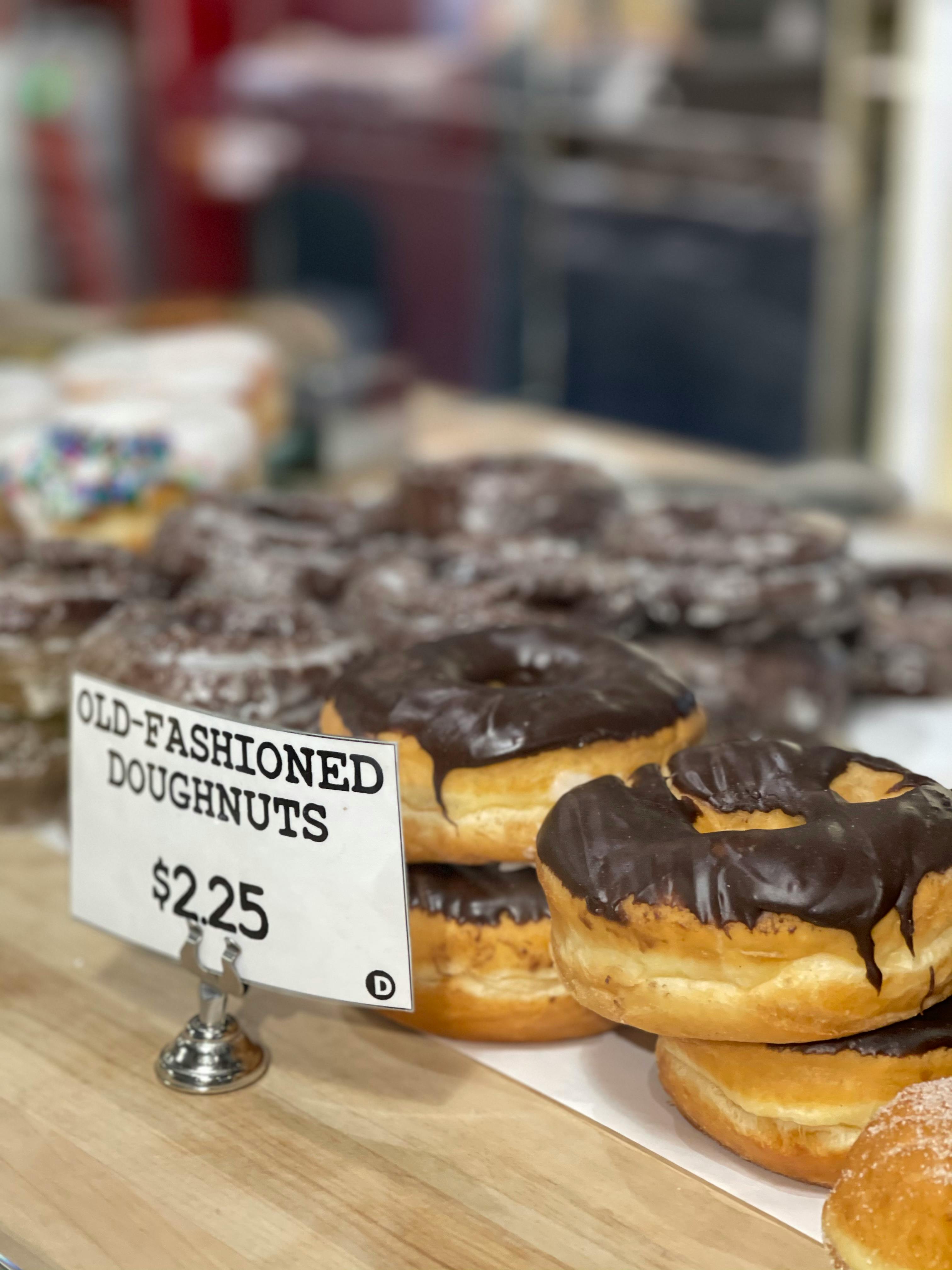 chocolate glazed donuts on display