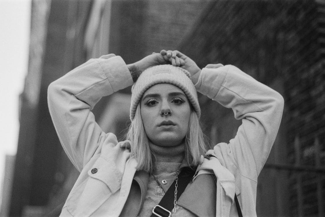 Grayscale Photo of Woman Wearing Beanie