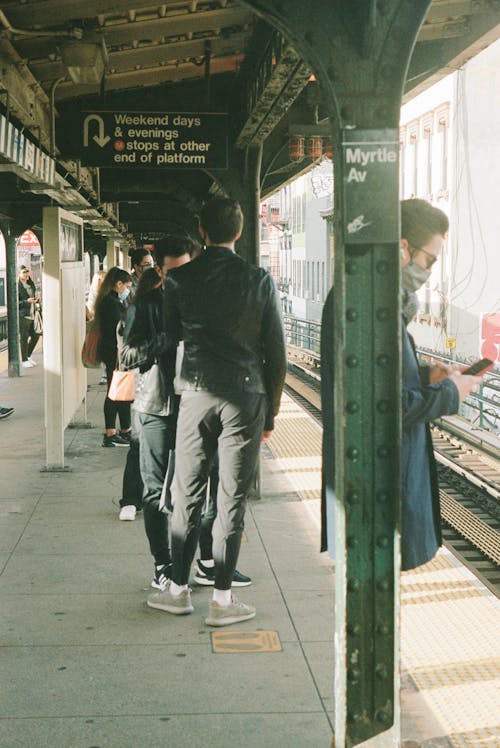 People Standing at the Train Station