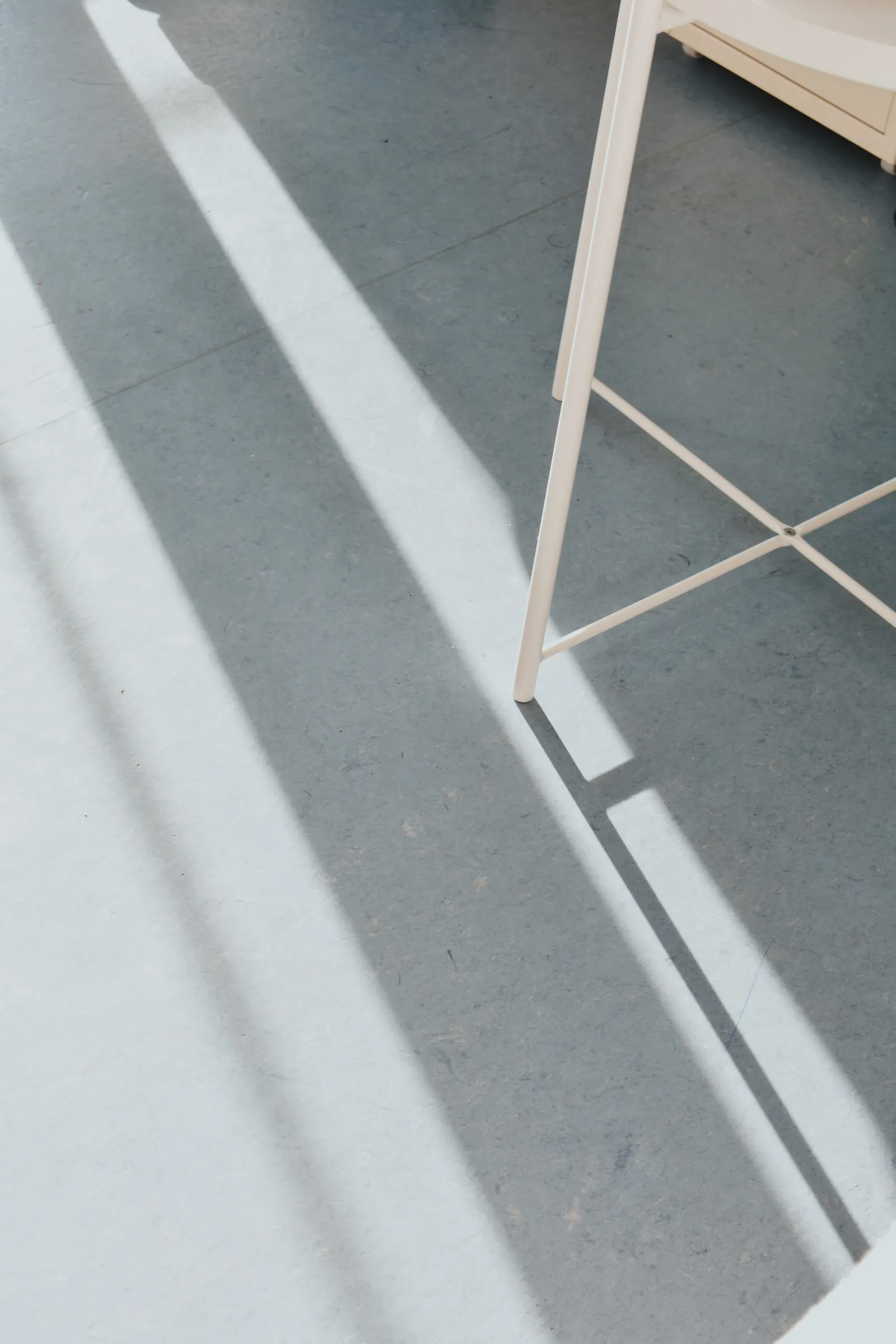 Metal chair casting long shadows