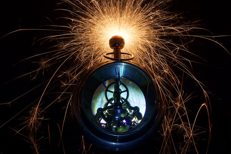 Pocket Watch With Glowing Sparks