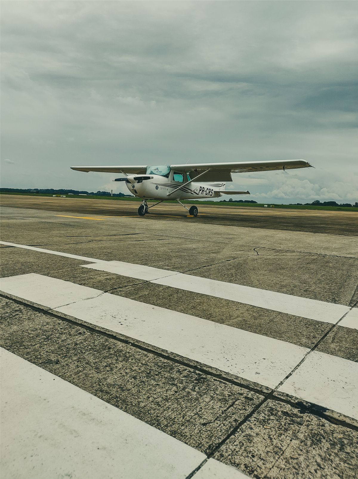 Cessna GA aircraft on a ramp — flying with firearms in personal aircraft requires careful legal preparation
