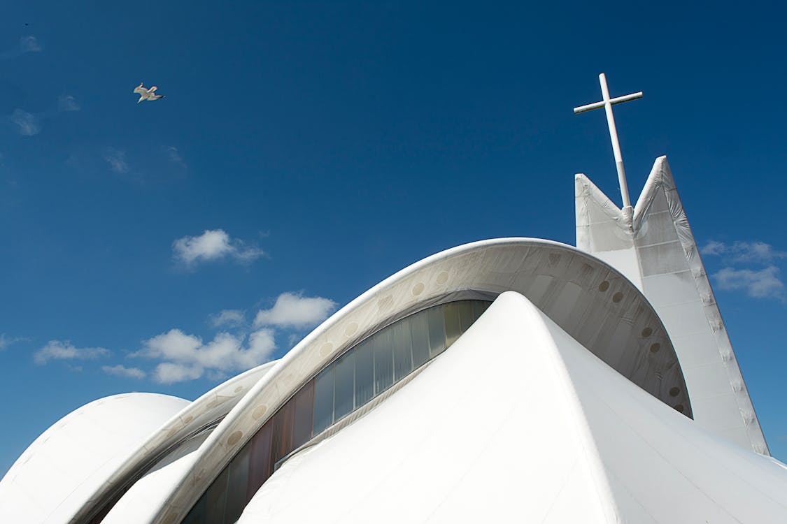 White Church Building with Cross on Top