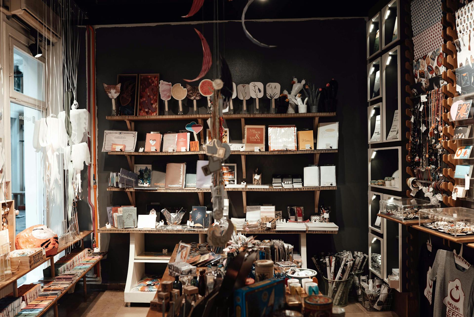 Aged souvenir shop with various gifts and vintage goods placed on wooden shelves