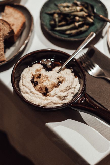 A smoky, creamy Levantine eggplant dip made by charring whole eggplants over an open flame, then blending the flesh with tahini, lemon, and garlic.