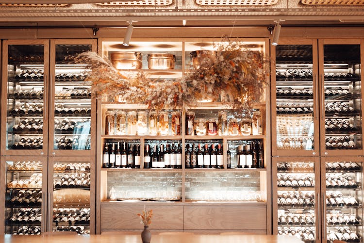 Shelves With Wine Bottles In Modern Restaurant