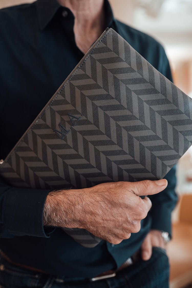 Unrecognizable Stylish Man With Clutch Bag In Hand