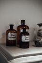 Set of bottles with various tinctures and aromatic essential oils placed on shelf in store
