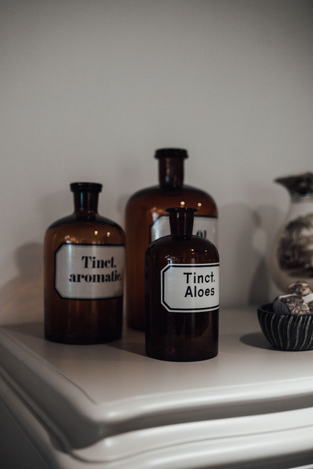 Bottles of natural essential oils on shelf in store · Free Stock Photo