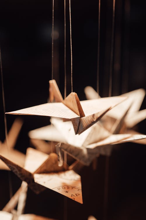 Decorative origami cranes hanging on threads