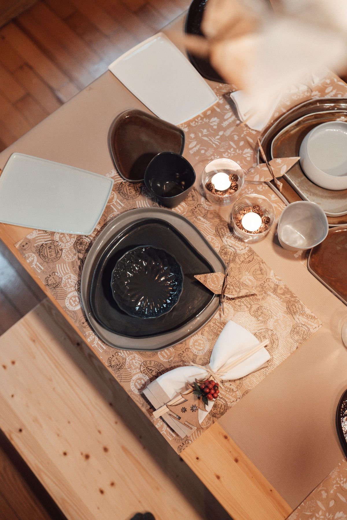 Refined dining table arranged with plates, bowls, glasses and serving pieces