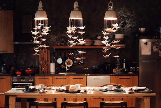Warm and inviting kitchen with artistic paper origami lighting decor over a dining table.