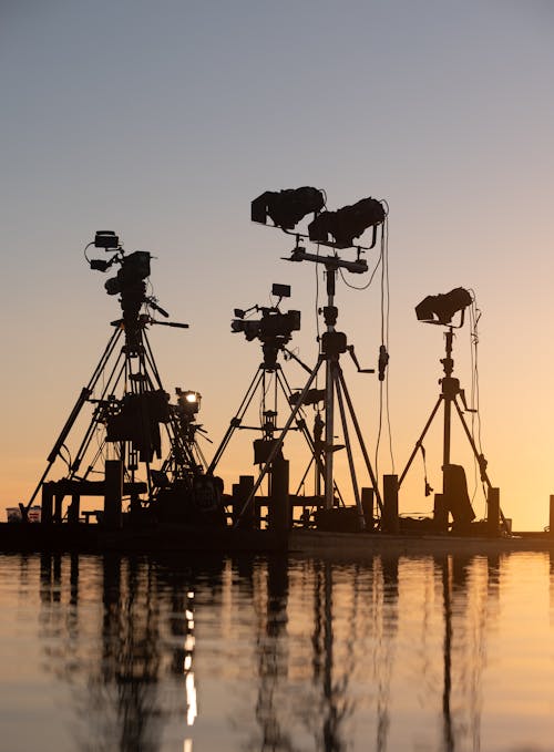 Spotlights and cameras on tripod for shooting in pond