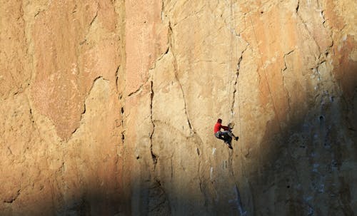 Person Rock Climbing