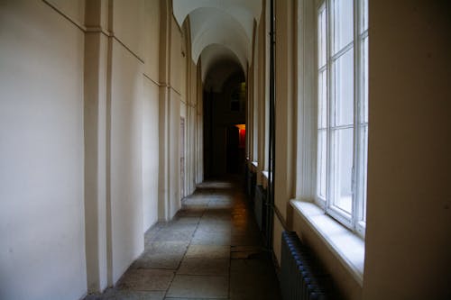 Free A Narrow Hallway Inside a Building Stock Photo