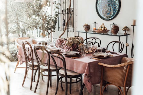 Dining room with served table decorated with flowers