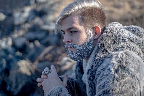 Close-Up Photo of a Man with Glitters on His Beard