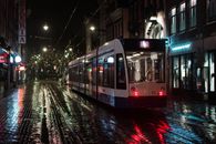 Red and White Train on Rail Road during Night Time