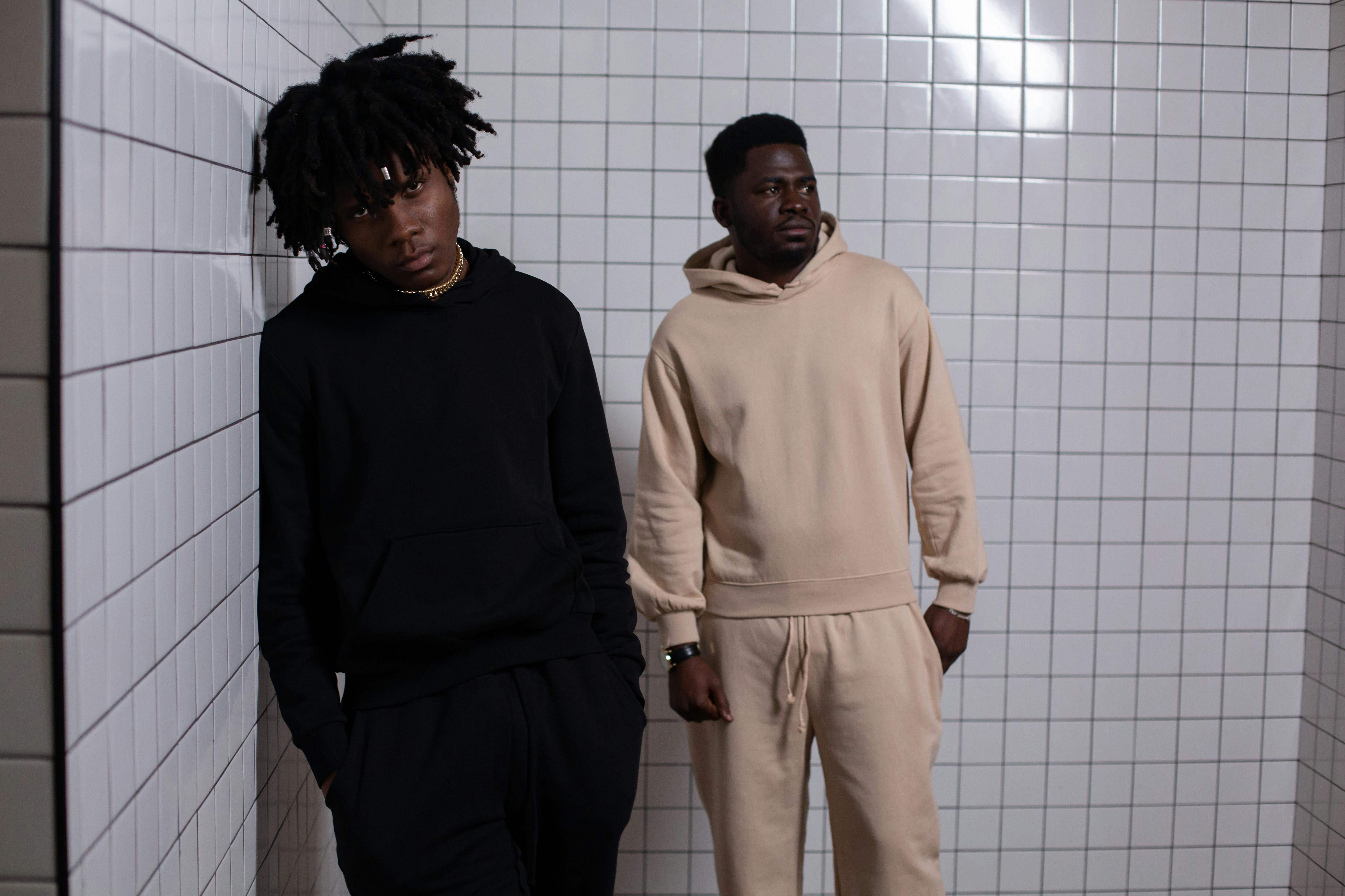 arrogant black men standing in tiled room