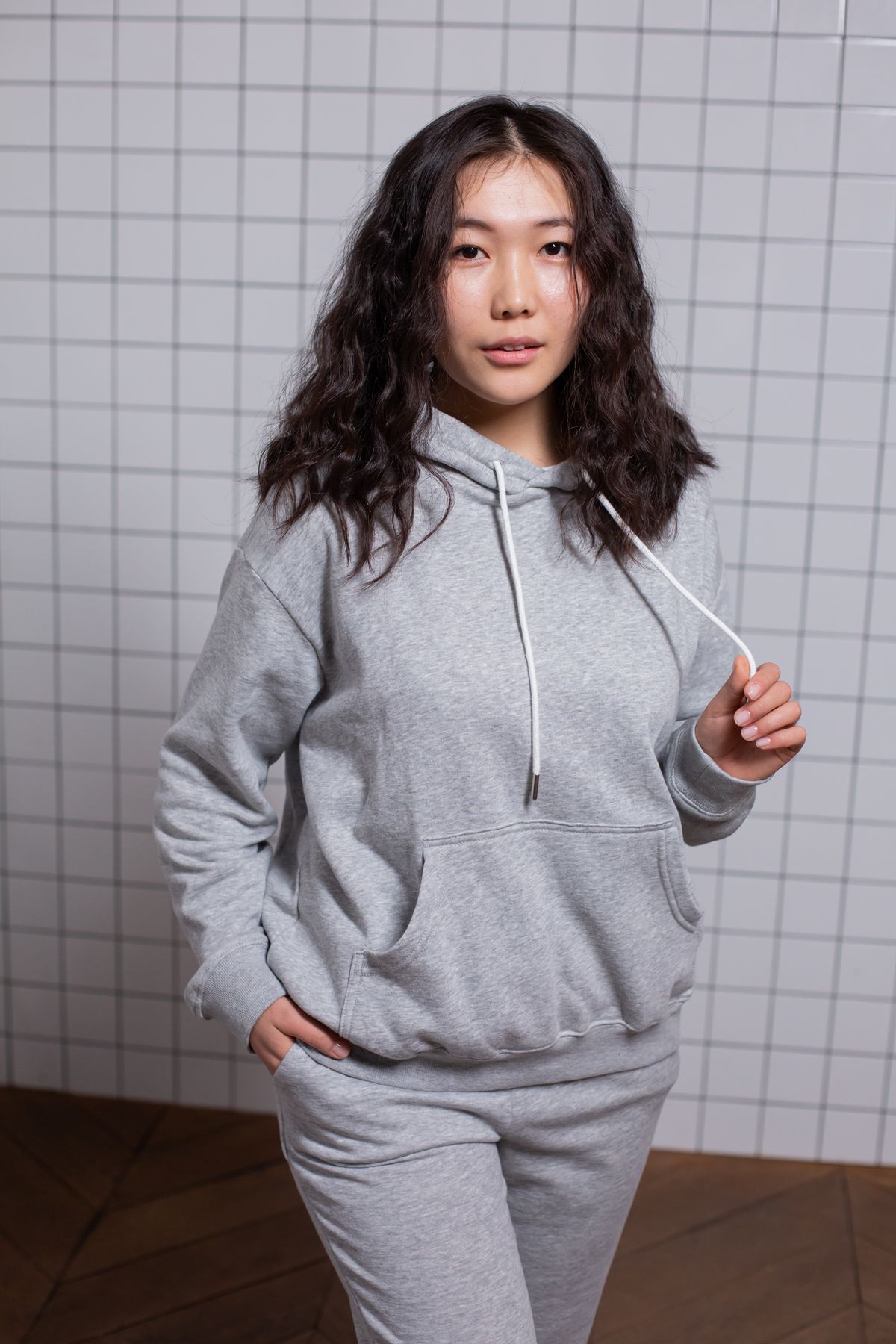 Woman in a grey hoodie