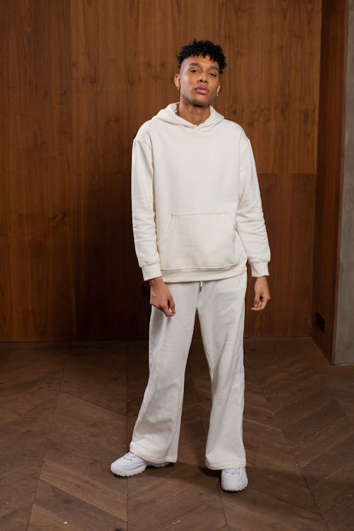 Black man in stylish white sportswear