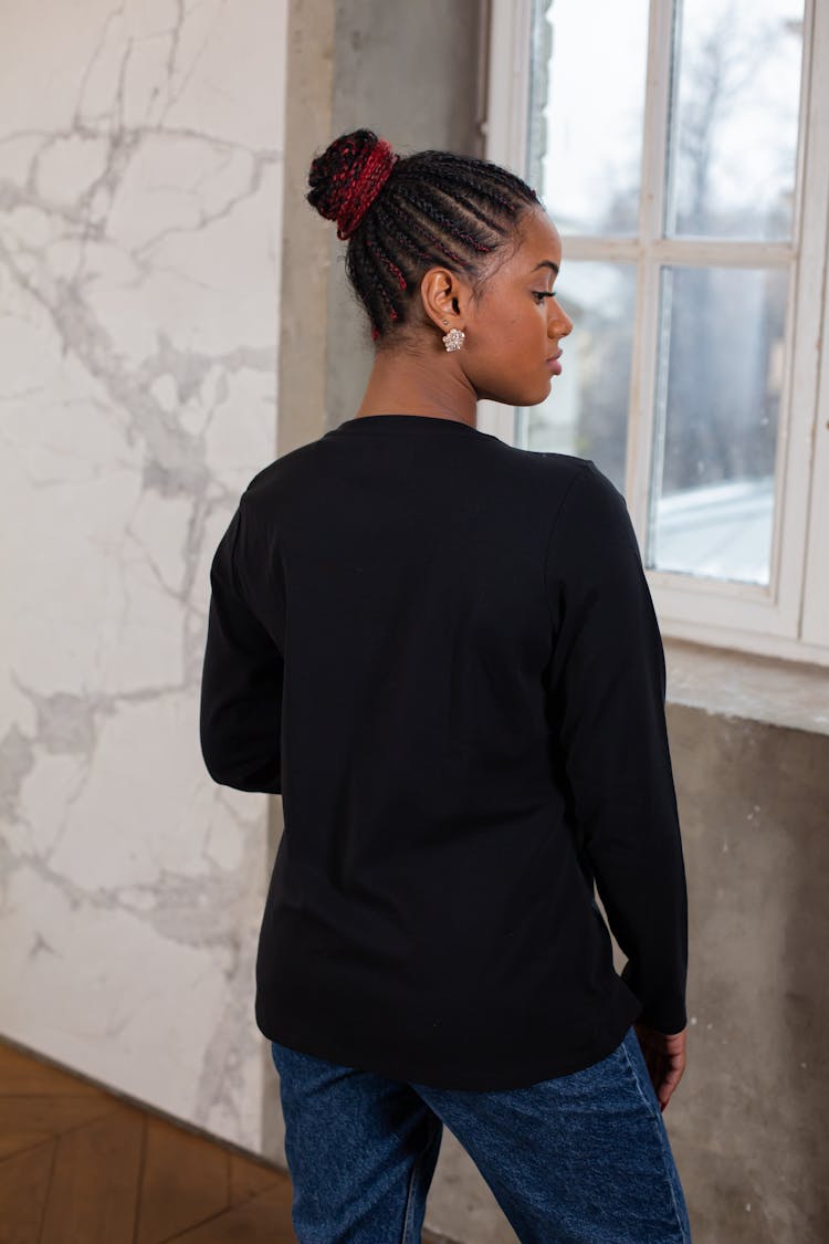 Serious Young Stylish Black Woman Near Window