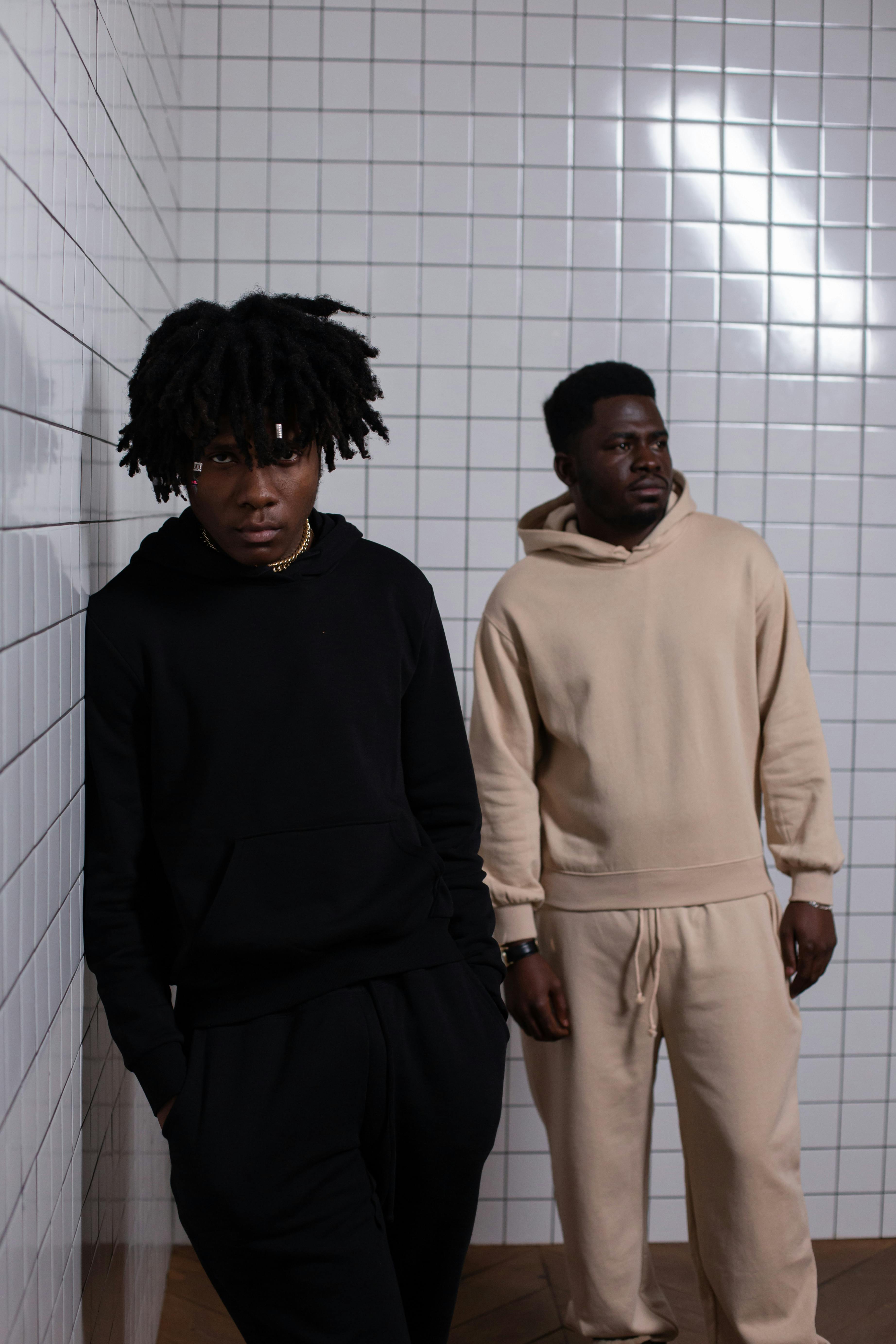 Confident African American men standing at tiled wall · Free Stock Photo Confident African American men standing at tiled wall · Free Stock Photo