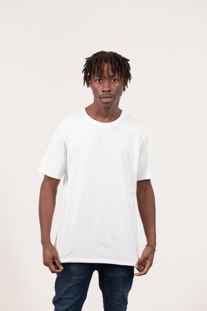 Model in a plain white oversized cotton t-shirt — photo by Monstera Production on Pexels
