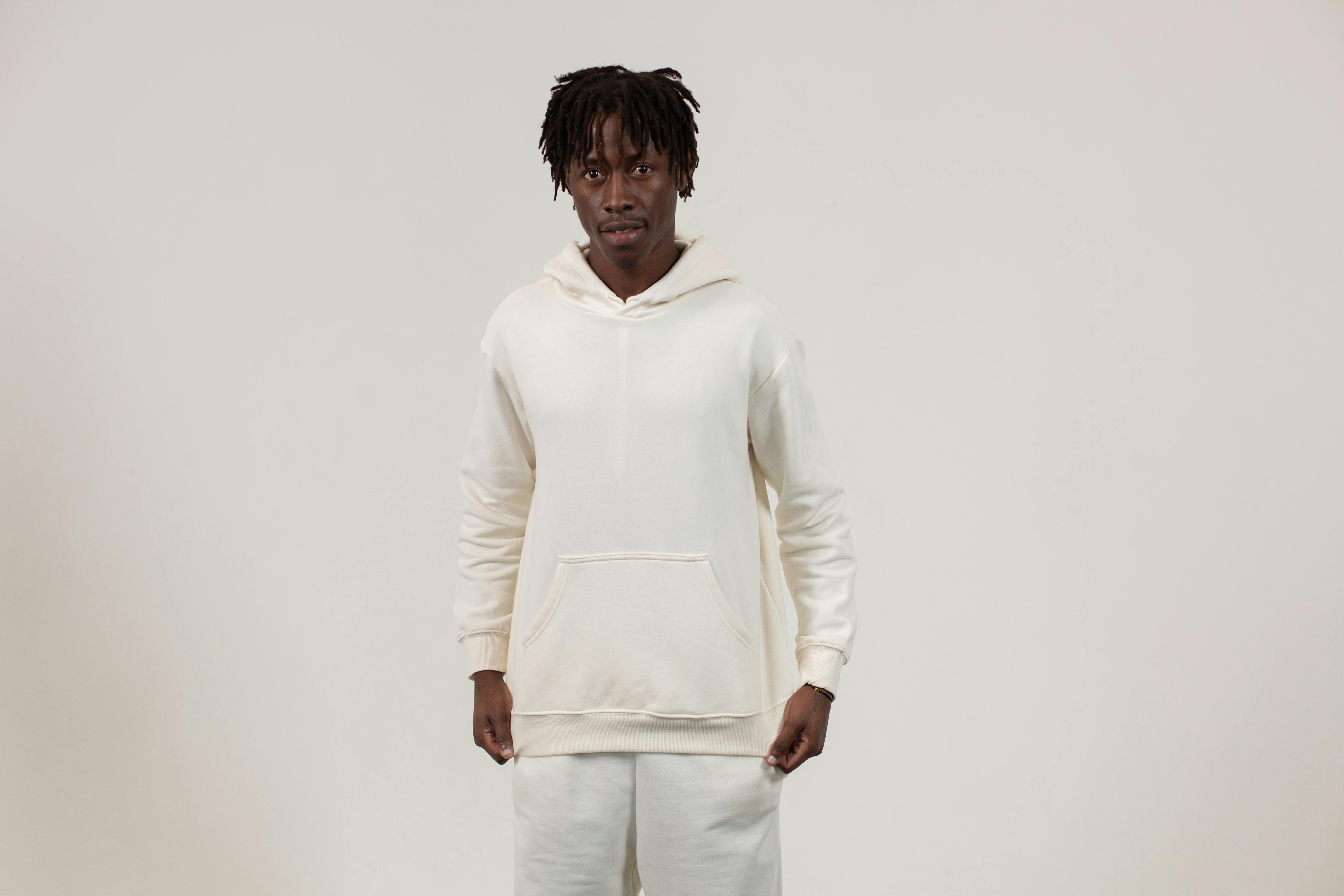 Emotionless black men in sportswear standing in light studio · Free ...