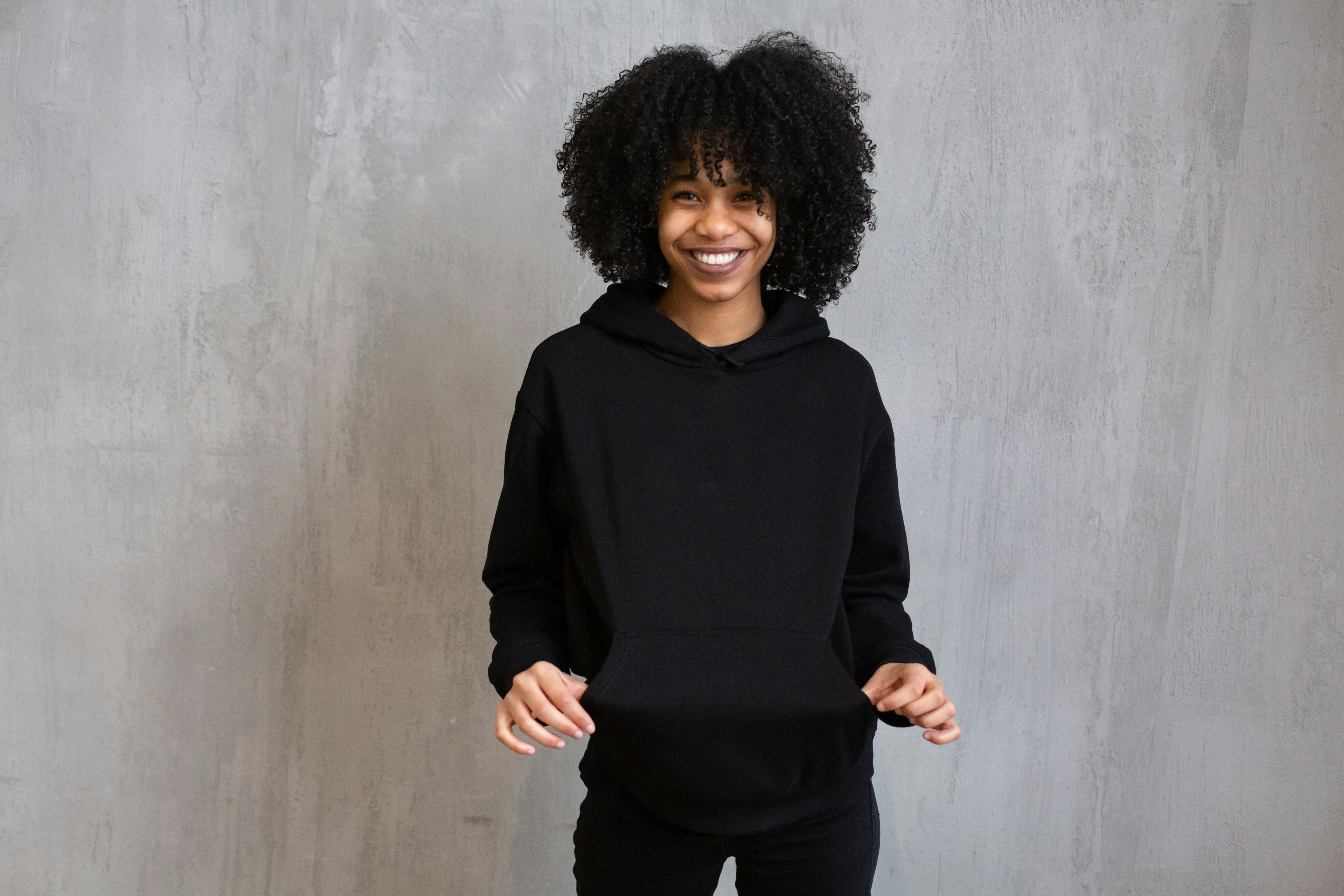 Content black woman in comfy sportswear in studio · Free Stock Photo