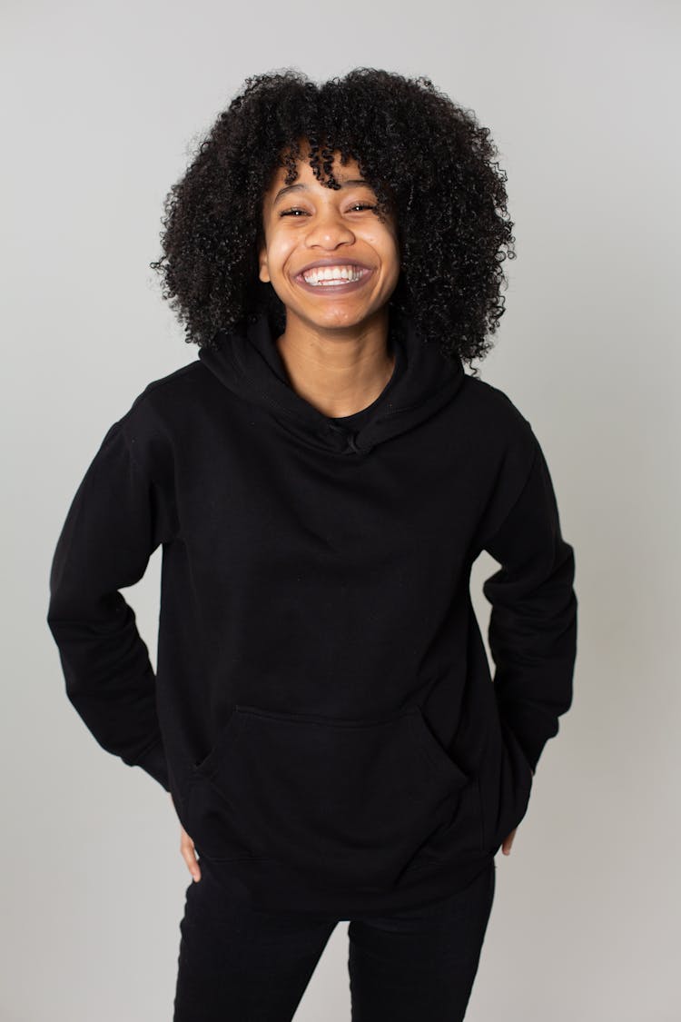 Delighted Black Woman In Hoodie