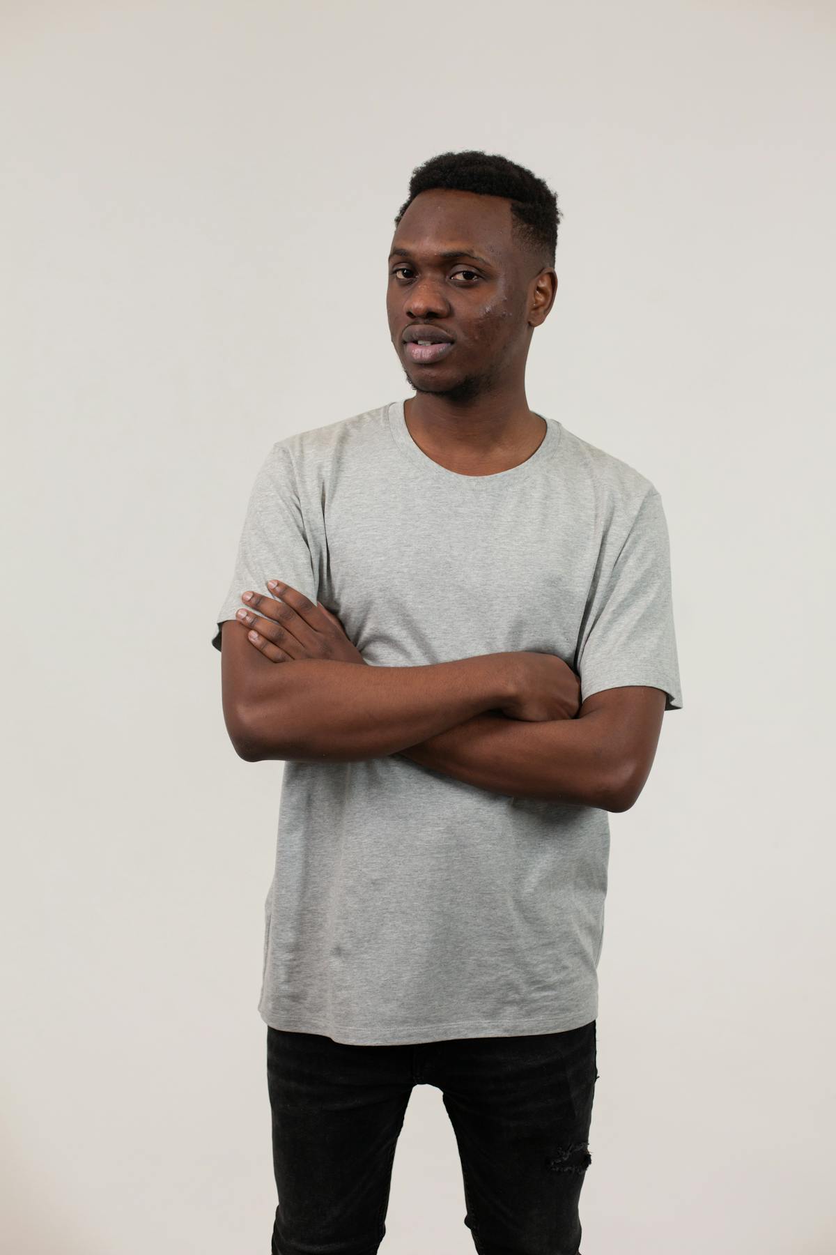 Runway model in a sheer dress layered over undergarments at a fashion show