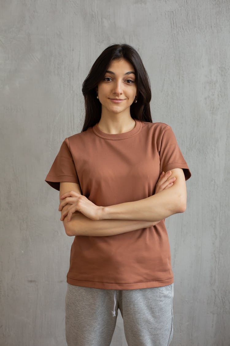 Smiling Young Woman In Casual Outfit In Studio